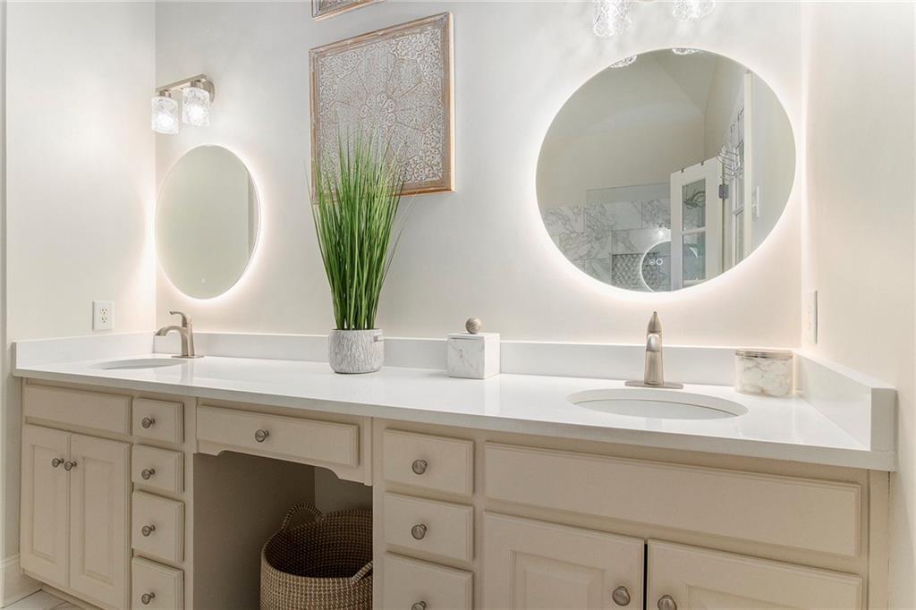 960 Providence Lane Monroe, GA 30656 - Photo 27 of 53 a bathroom with a double vanity sink and a mirror