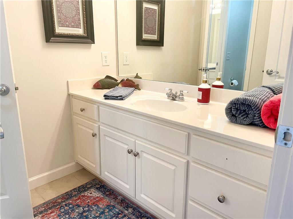 960 Providence Lane Monroe, GA 30656 - Photo 35 of 53 a bathroom with a sink and a mirror