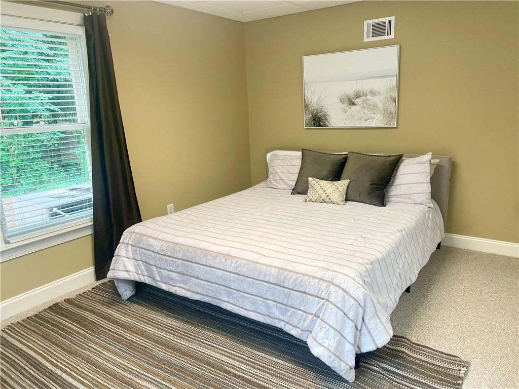 960 Providence Lane Monroe, GA 30656 - Photo 40 of 53 a bedroom with bed and wooden floor