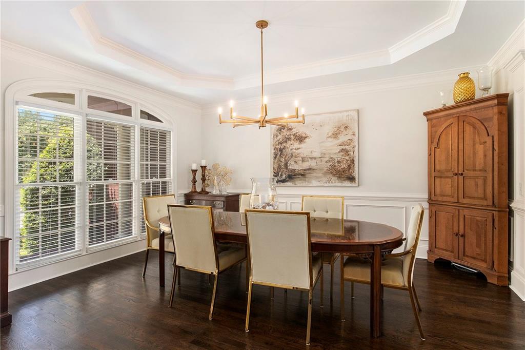 960 Providence Lane Monroe, GA 30656 - Photo 4 of 53 a view of a dining room with furniture window and wooden floor