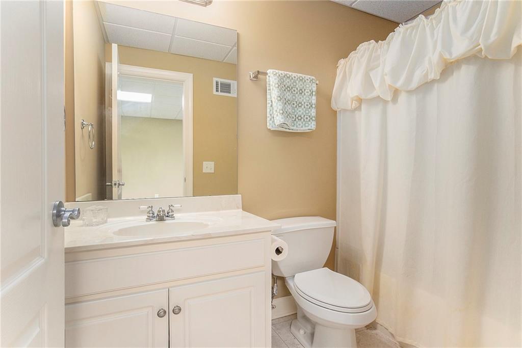 960 Providence Lane Monroe, GA 30656 - Photo 41 of 53 a bathroom with a sink a toilet and a mirror