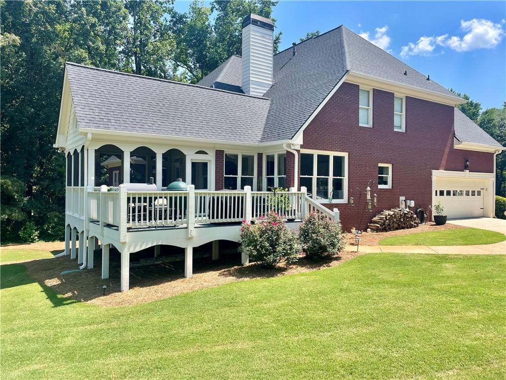 960 Providence Lane Monroe, GA 30656 - Photo 44 of 53 a view of a house with a yard and sitting area