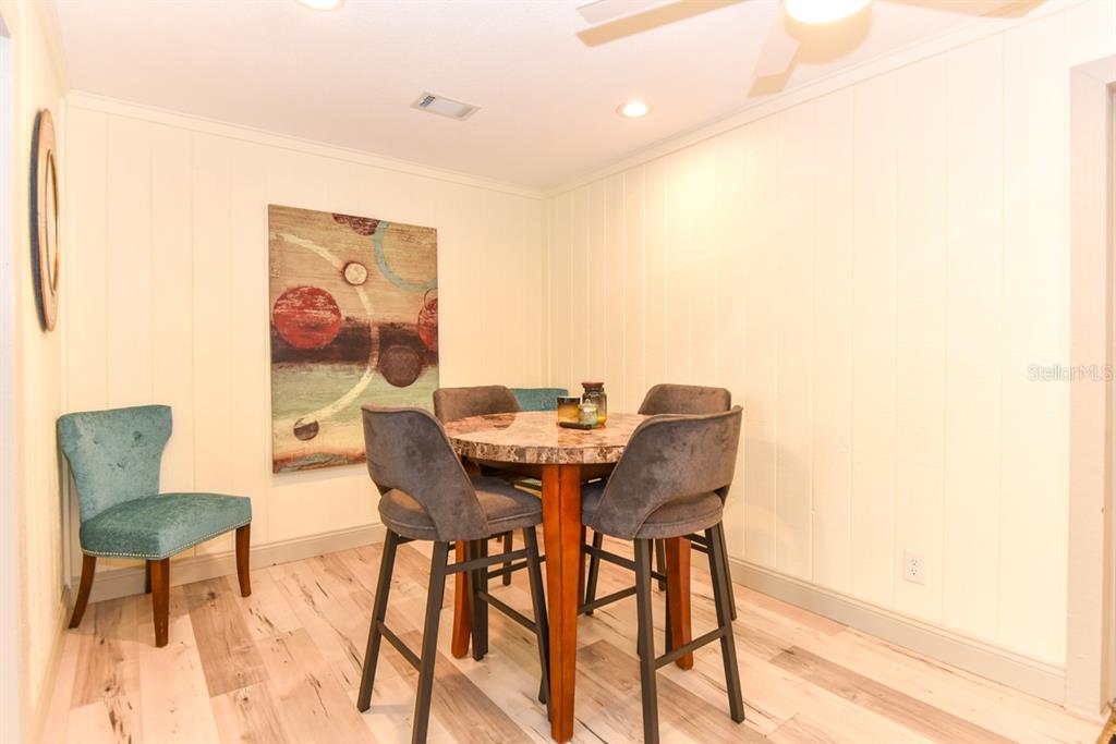213 Riverbend Road Ormond Beach, FL 32174 - Photo 22 of 78 a view of a dining room with furniture and a small wooden floor