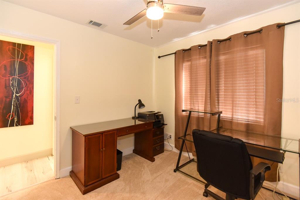 213 Riverbend Road Ormond Beach, FL 32174 - Photo 36 of 78 a view of a workspace with furniture and a window