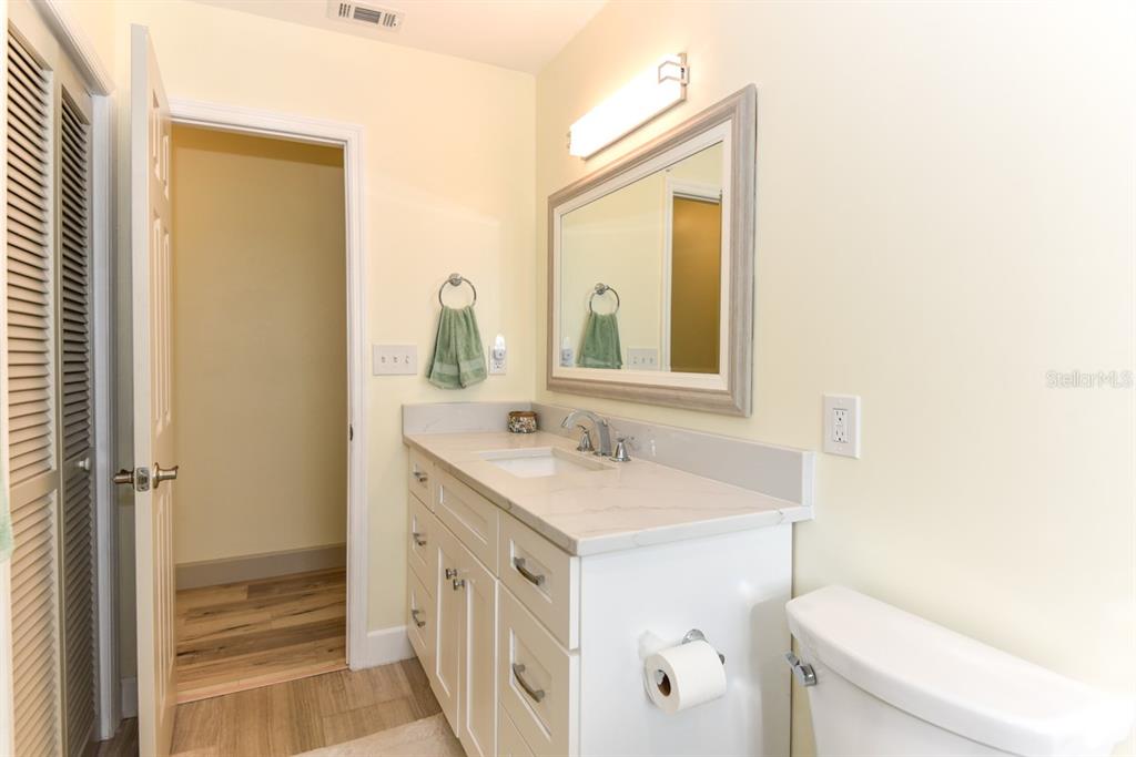 213 Riverbend Road Ormond Beach, FL 32174 - Photo 40 of 78 a bathroom with a sink a toilet and a mirror