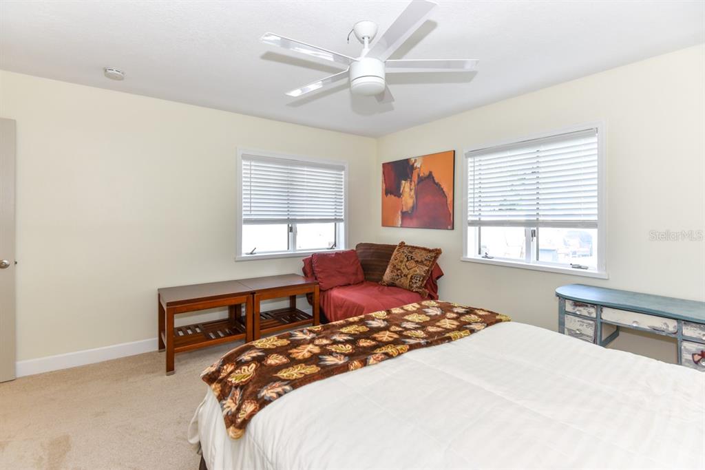 213 Riverbend Road Ormond Beach, FL 32174 - Photo 43 of 78 a bedroom with a bed and a large window