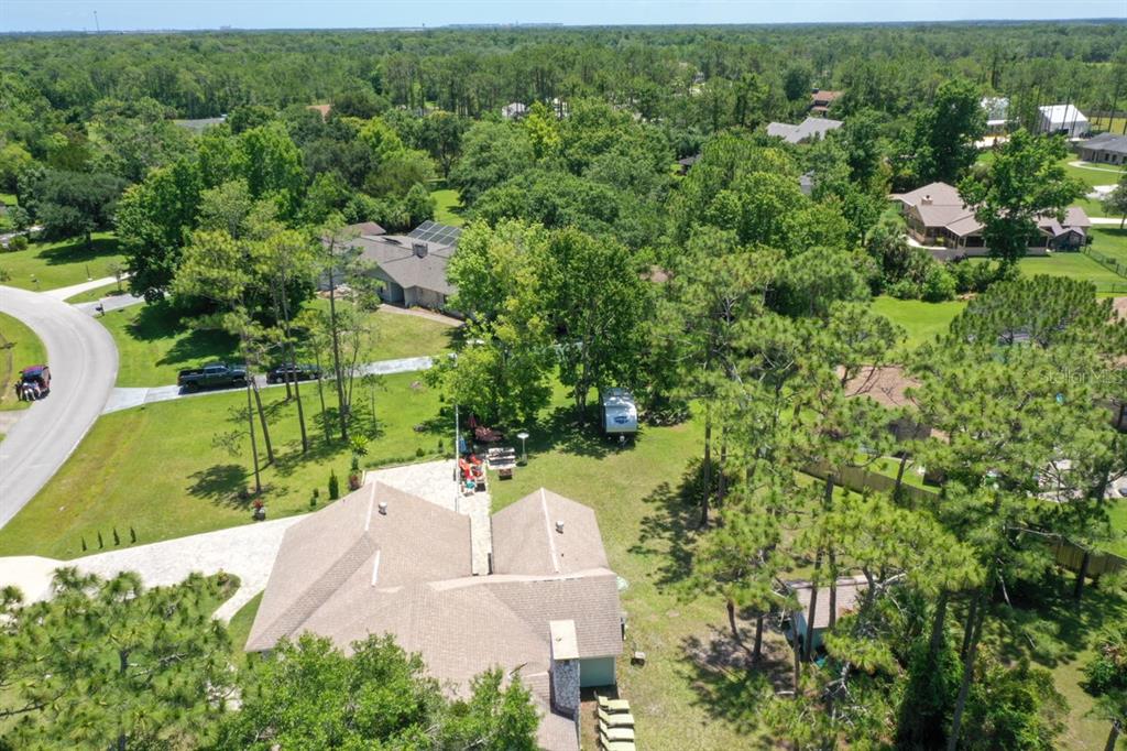 213 Riverbend Road Ormond Beach, FL 32174 - Photo 47 of 78 an aerial view of a house with a yard