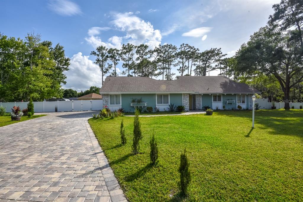 213 Riverbend Road Ormond Beach, FL 32174 - Photo 5 of 78 a view of a house with a swimming pool