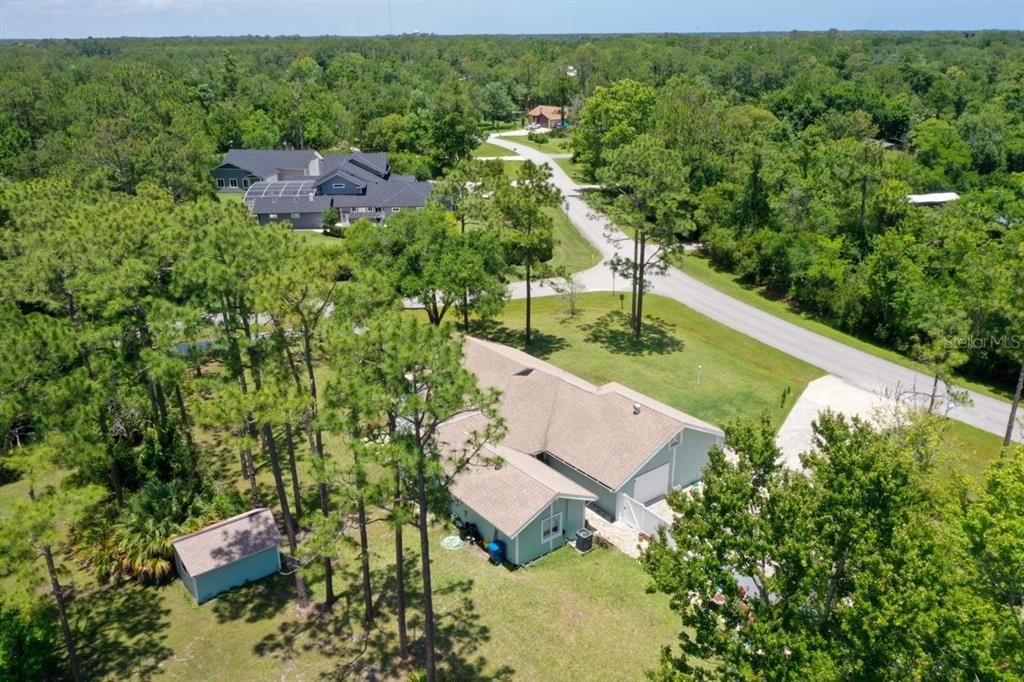 213 Riverbend Road Ormond Beach, FL 32174 - Photo 51 of 78 an aerial view of a house with a yard