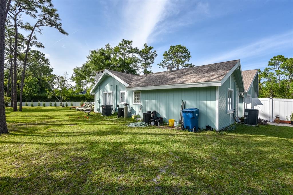 213 Riverbend Road Ormond Beach, FL 32174 - Photo 63 of 78 a front view of a house with a yard