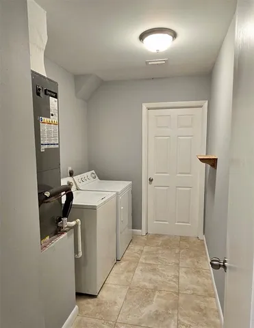a view of a storage & utility room with a sink