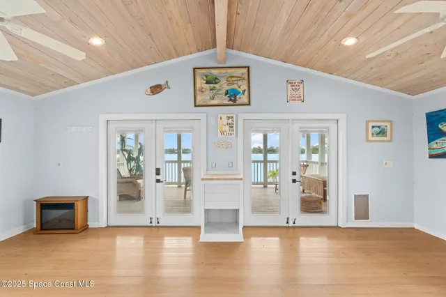 a view of an entryway with wooden floor