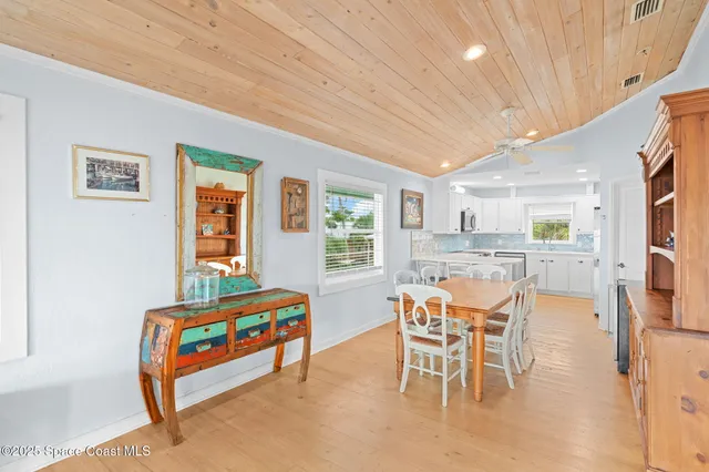 a dining room with a table and chairs