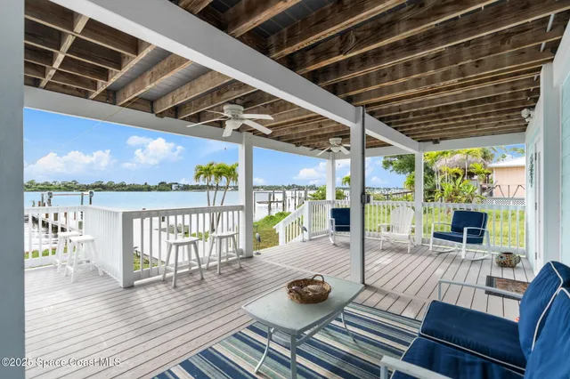a view of a balcony with furniture and a table
