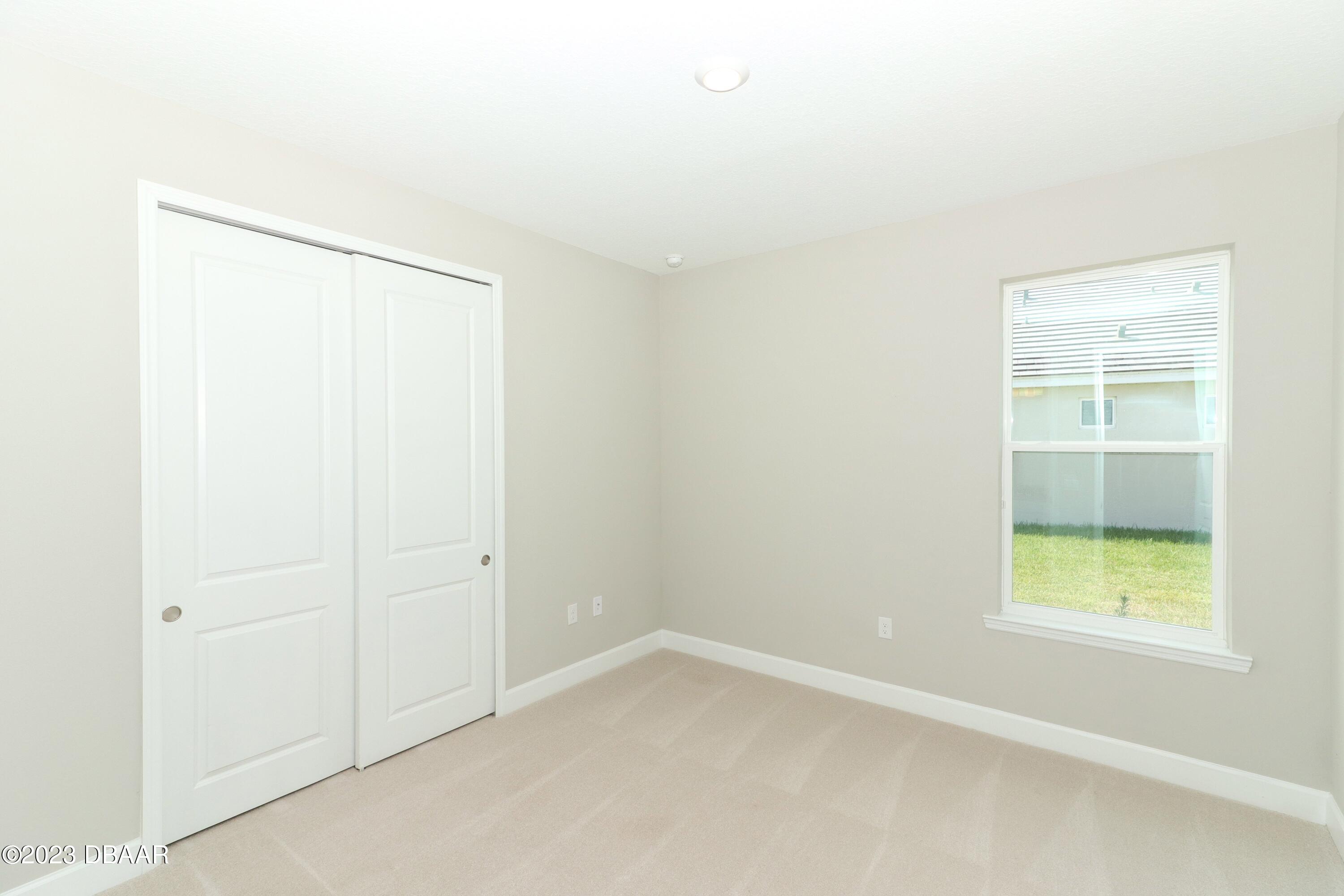 1376 Arklow Circle Ormond Beach, FL 32174 - Photo 22 of 40 41024062-028-Guest_Bedroom