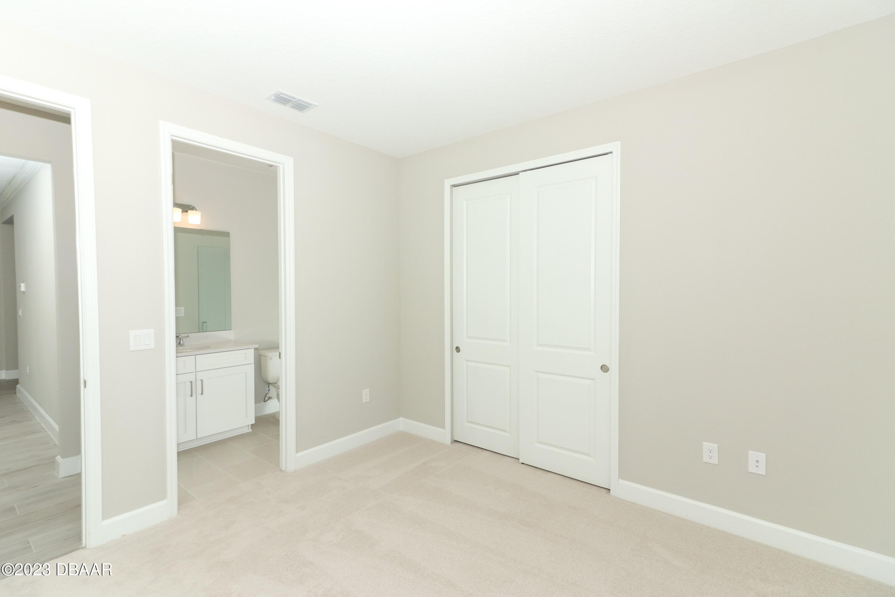 1376 Arklow Circle Ormond Beach, FL 32174 - Photo 23 of 40 41024062-029-Guest_Bedroom_Alt_View