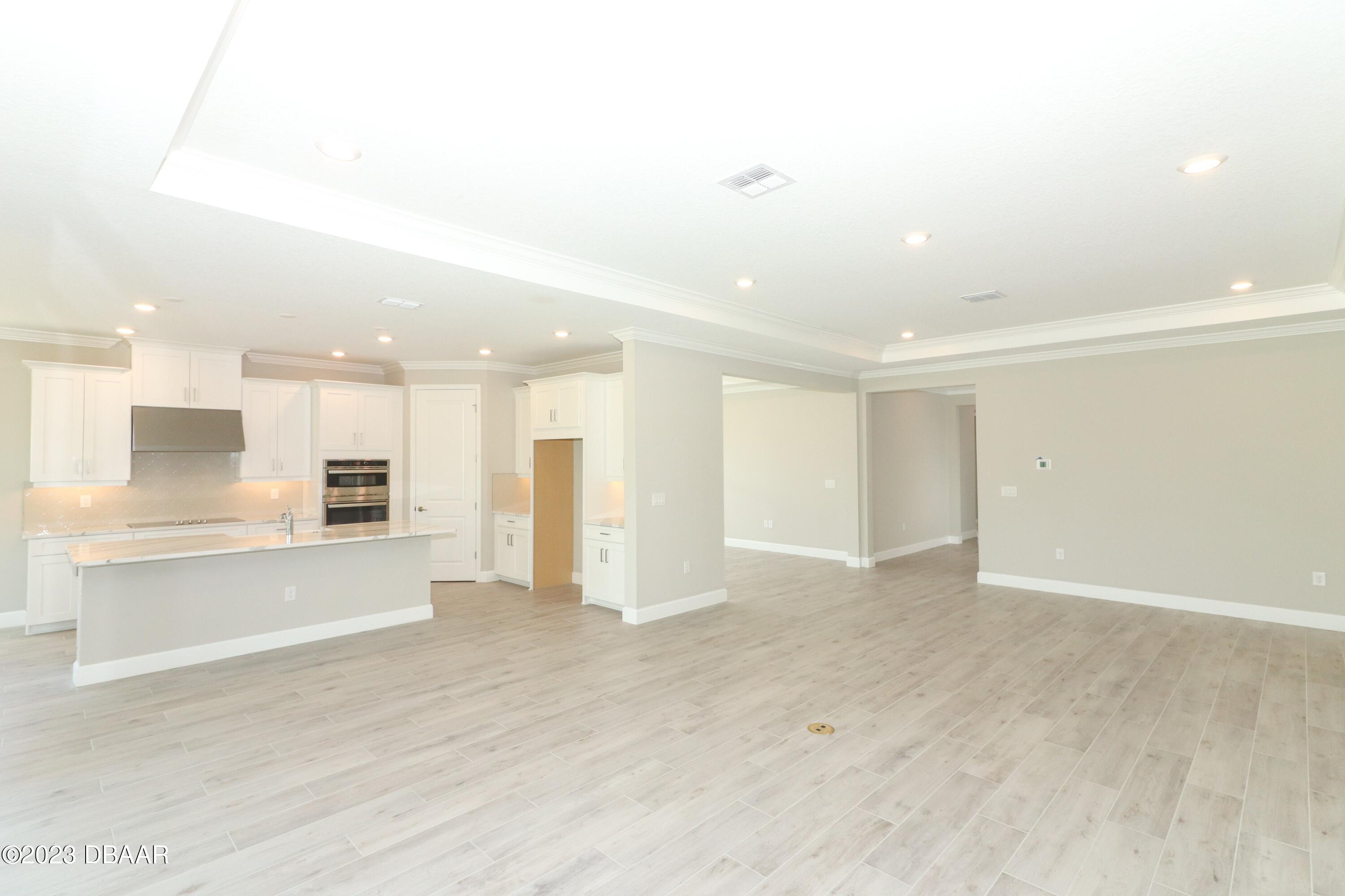 1376 Arklow Circle Ormond Beach, FL 32174 - Photo 7 of 40 41024062-007-Living_Room_Kitchen