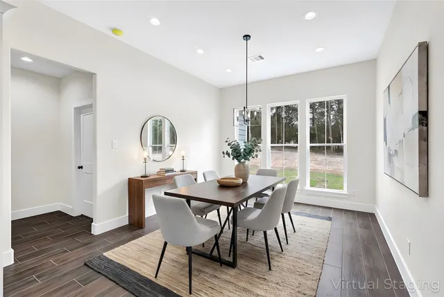 a view of a dining room with furniture window and wooden floor