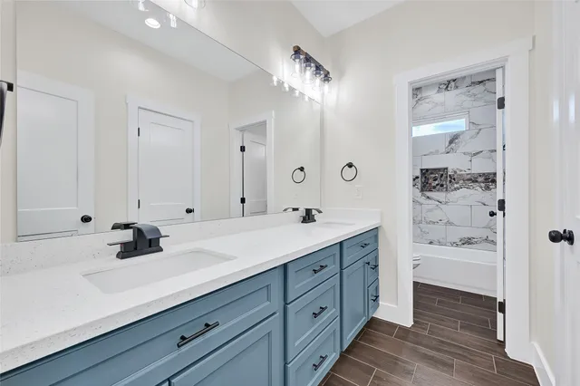 a bathroom with a sink double vanity and a mirror