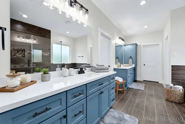 a spacious bathroom with a double vanity sink and a mirror
