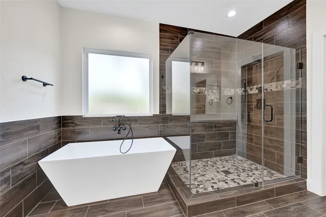 a bathroom with a sink a shower and a mirror
