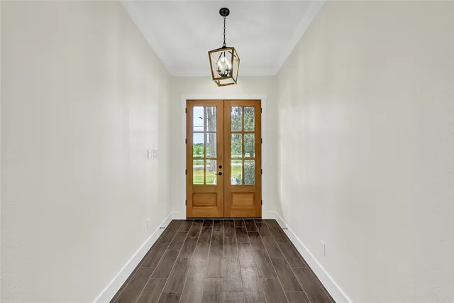 a view of an entryway with wooden floor