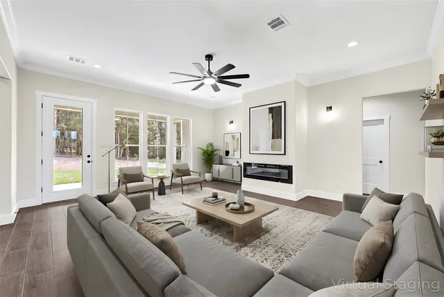 a living room with furniture and a large window
