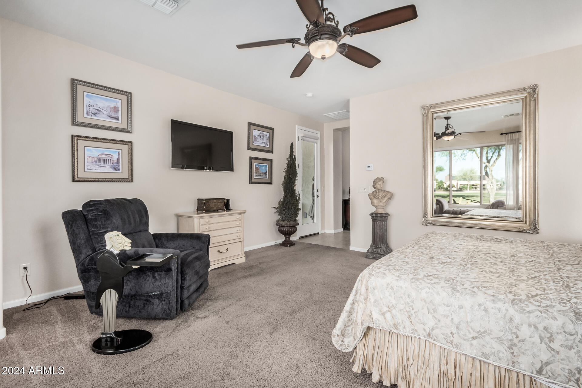 16538 West Berkeley Road Goodyear, AZ 85395 - Photo 12 of 31 a bedroom with furniture and a window