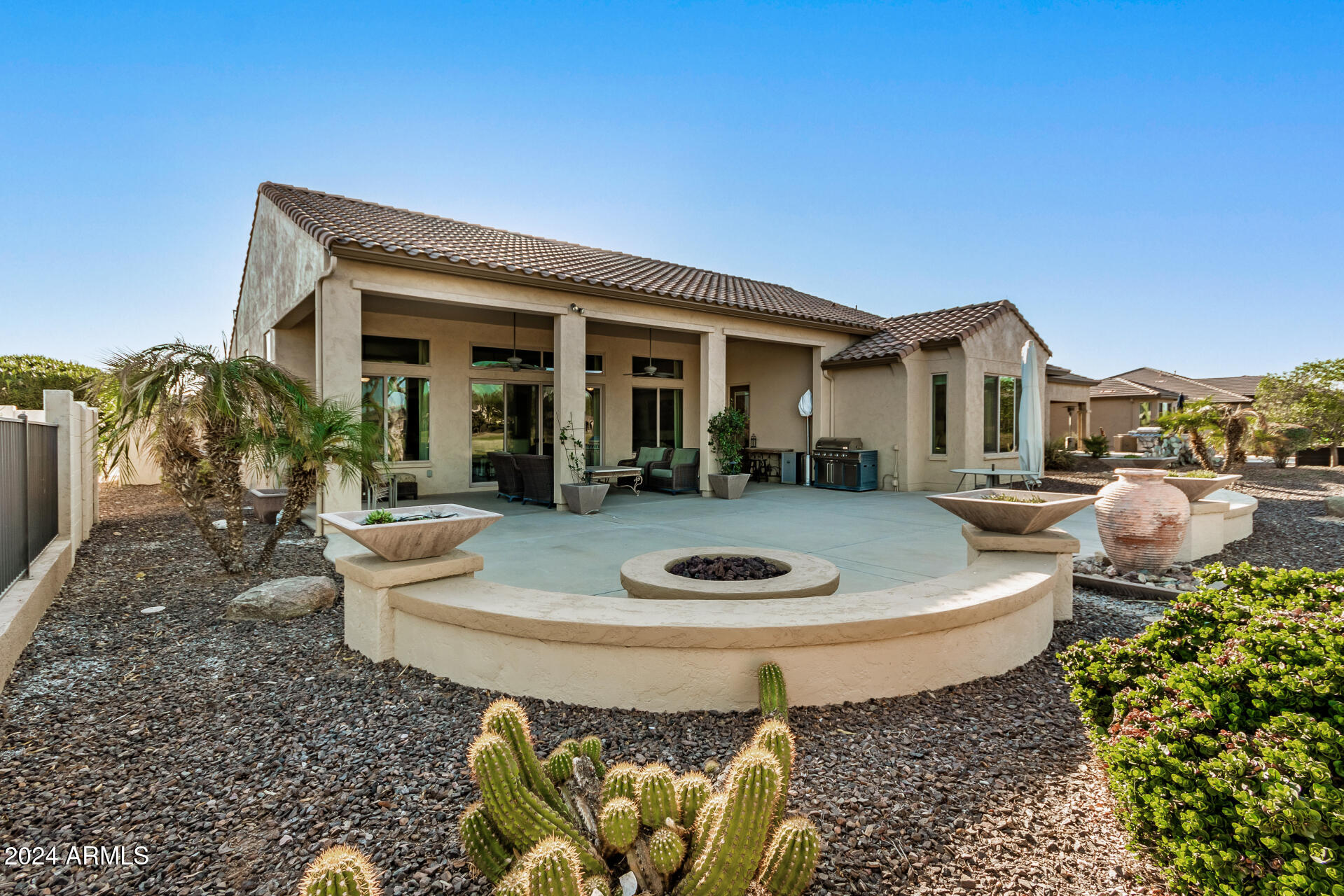 16538 West Berkeley Road Goodyear, AZ 85395 - Photo 21 of 31 a table and chairs in front of the house