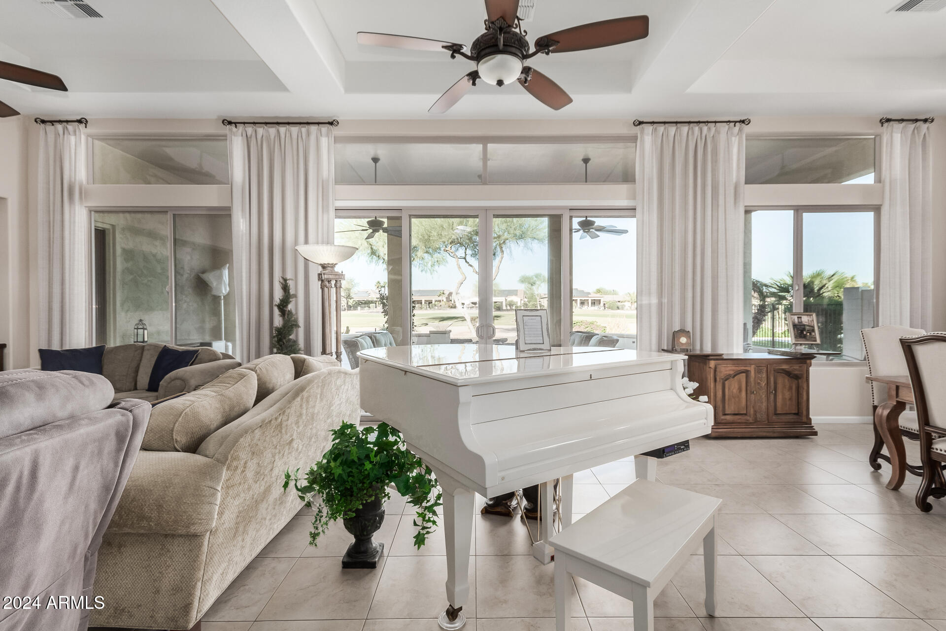 16538 West Berkeley Road Goodyear, AZ 85395 - Photo 6 of 31 a living room with furniture and a large window