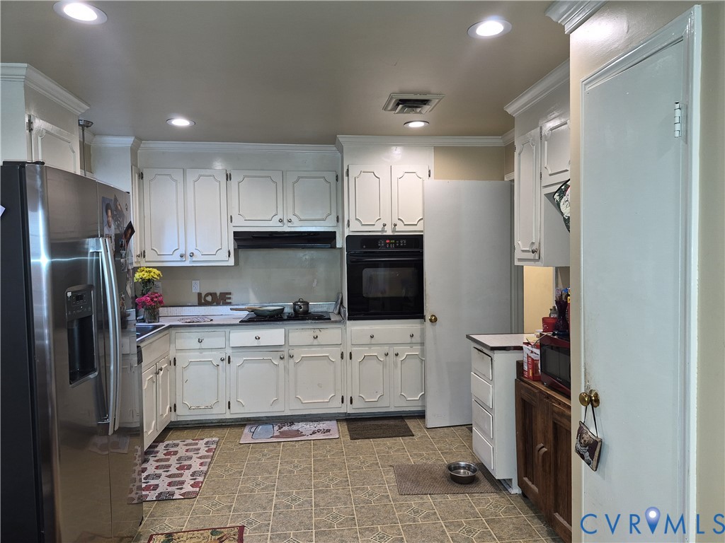 3818 Cedar Grove Road Richmond, VA 23235 - Photo 8 of 20 a kitchen with stainless steel appliances a refrigerator sink and microwave