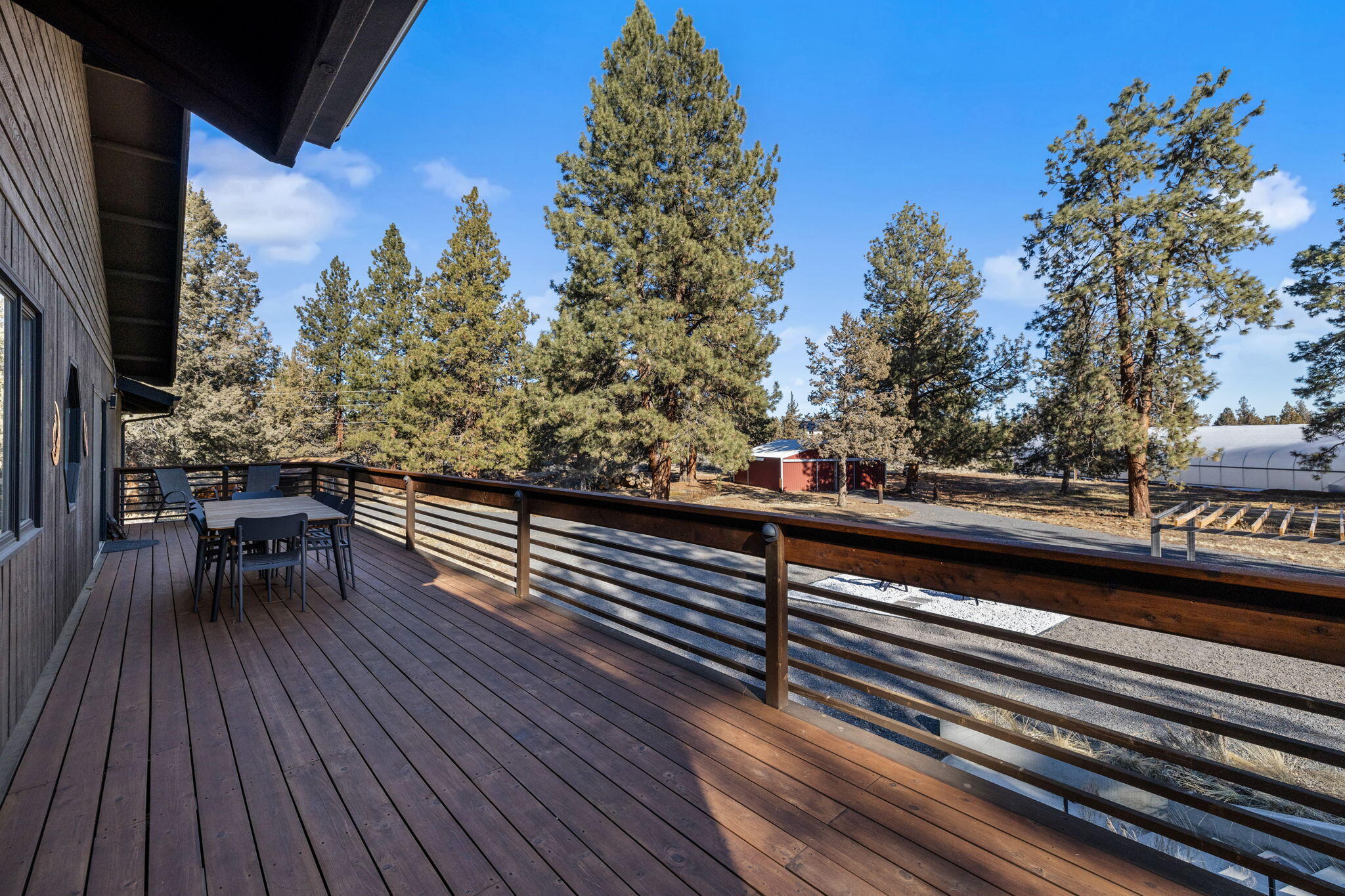 60340 Arnold Market Road Bend, OR 97702 - Photo 39 of 55 The new cedar deck spans the length of the home