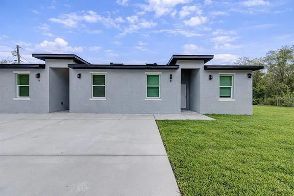 a view of a house with a garden