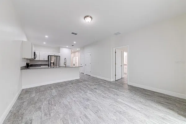 a view of kitchen with wooden floor