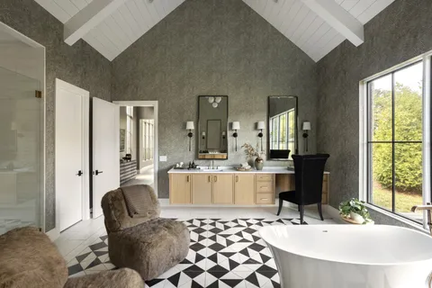 a living room with a couch and a large window