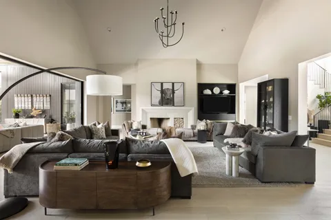 a living room with fireplace furniture and a flat screen tv