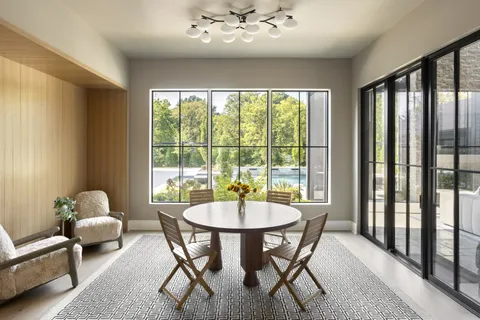 a view of a dining room with furniture window and outside view