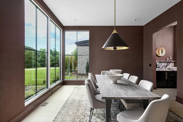 a dining room with furniture and window