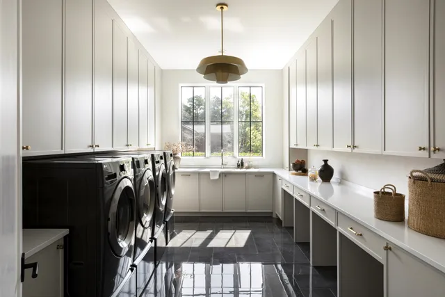 a bedroom with bed and glass window