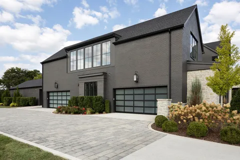 a view of a house with swimming pool and sitting area