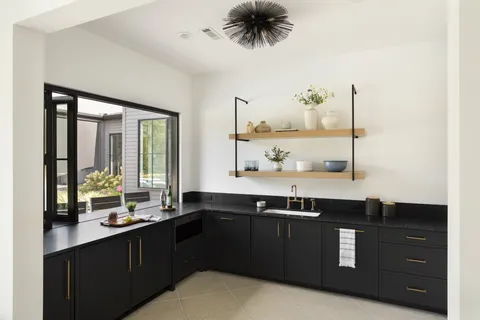 a kitchen with a sink and a stove