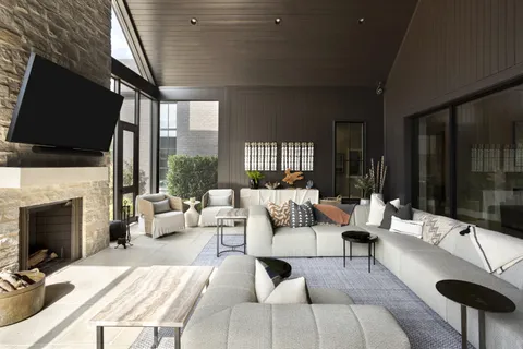 a living room with furniture fireplace and a flat screen tv