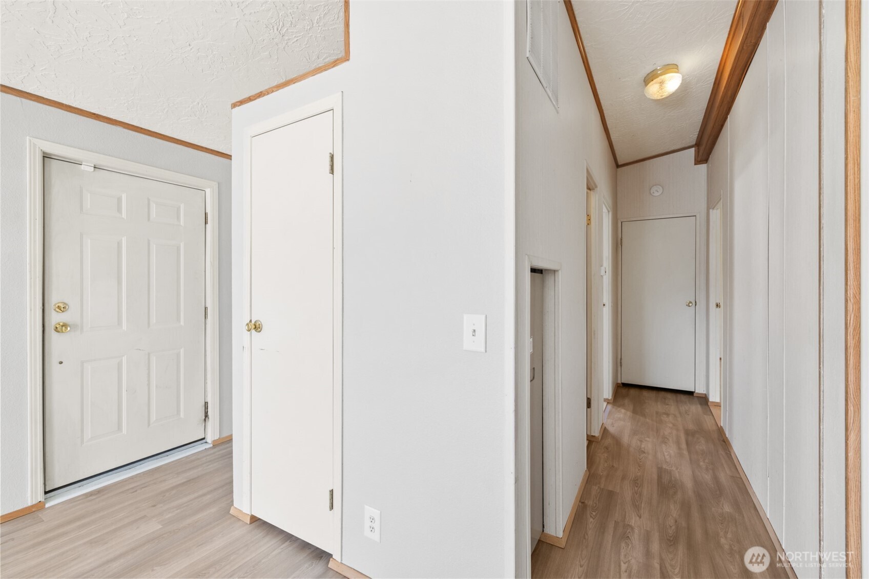 491 Mill Road, Unit 4 Sequim, WA 98382 - Photo 16 of 33 a view of a hallway with wooden floor
