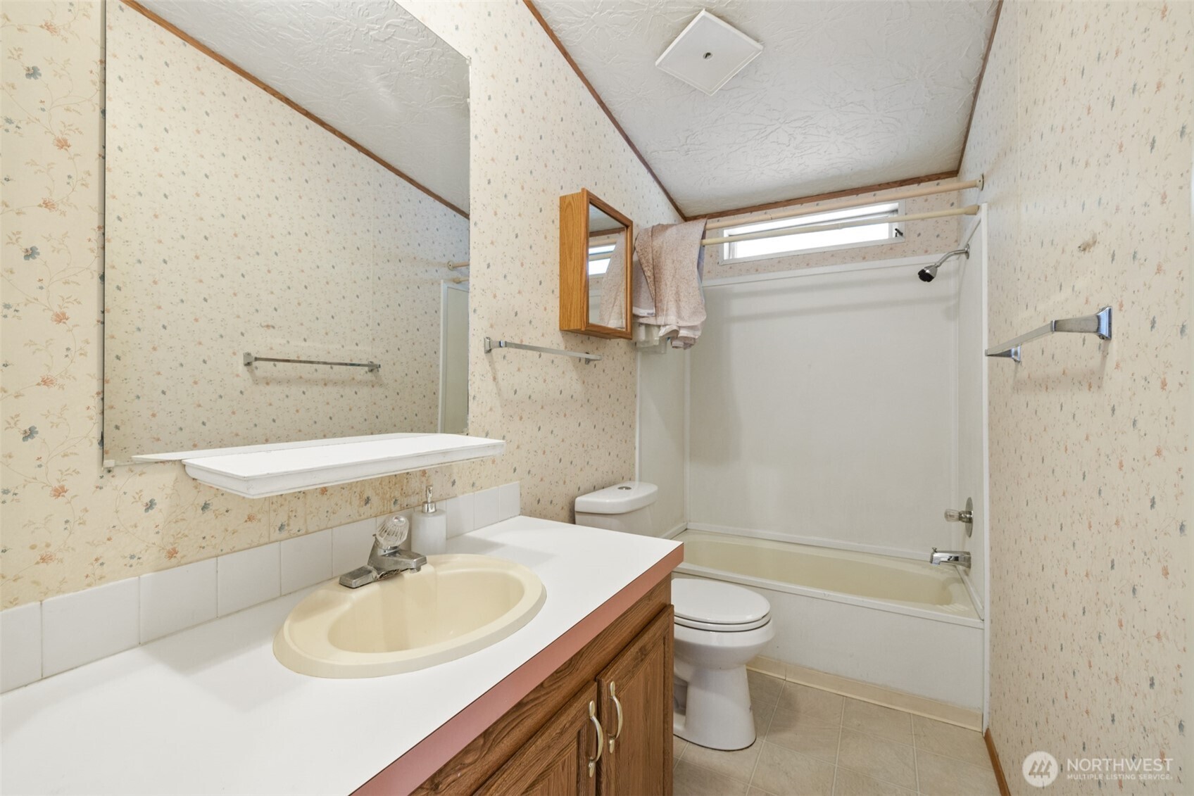 491 Mill Road, Unit 4 Sequim, WA 98382 - Photo 17 of 33 a bathroom with a granite countertop sink toilet and shower