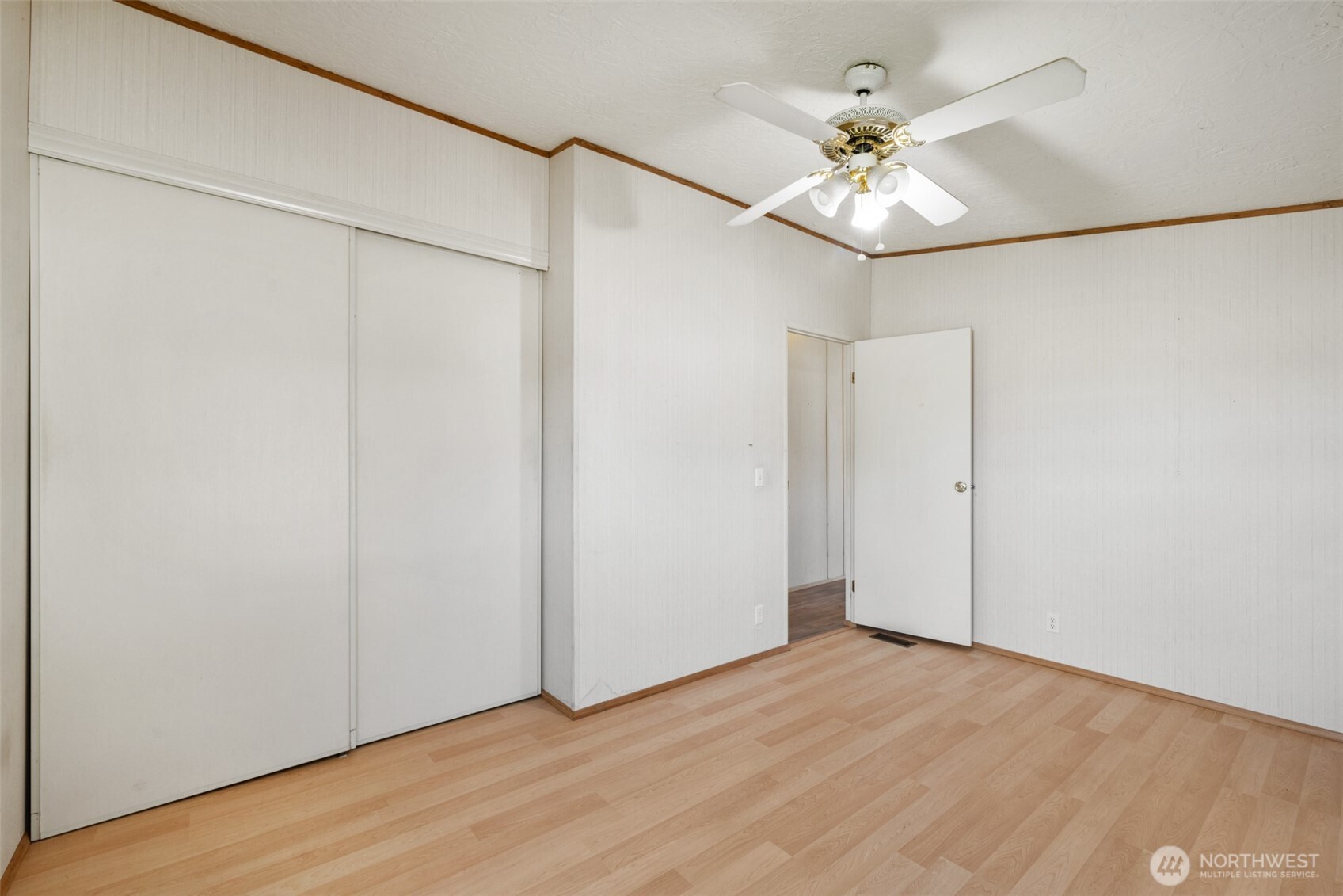 491 Mill Road, Unit 4 Sequim, WA 98382 - Photo 19 of 33 a view of an empty room with a chandelier fan