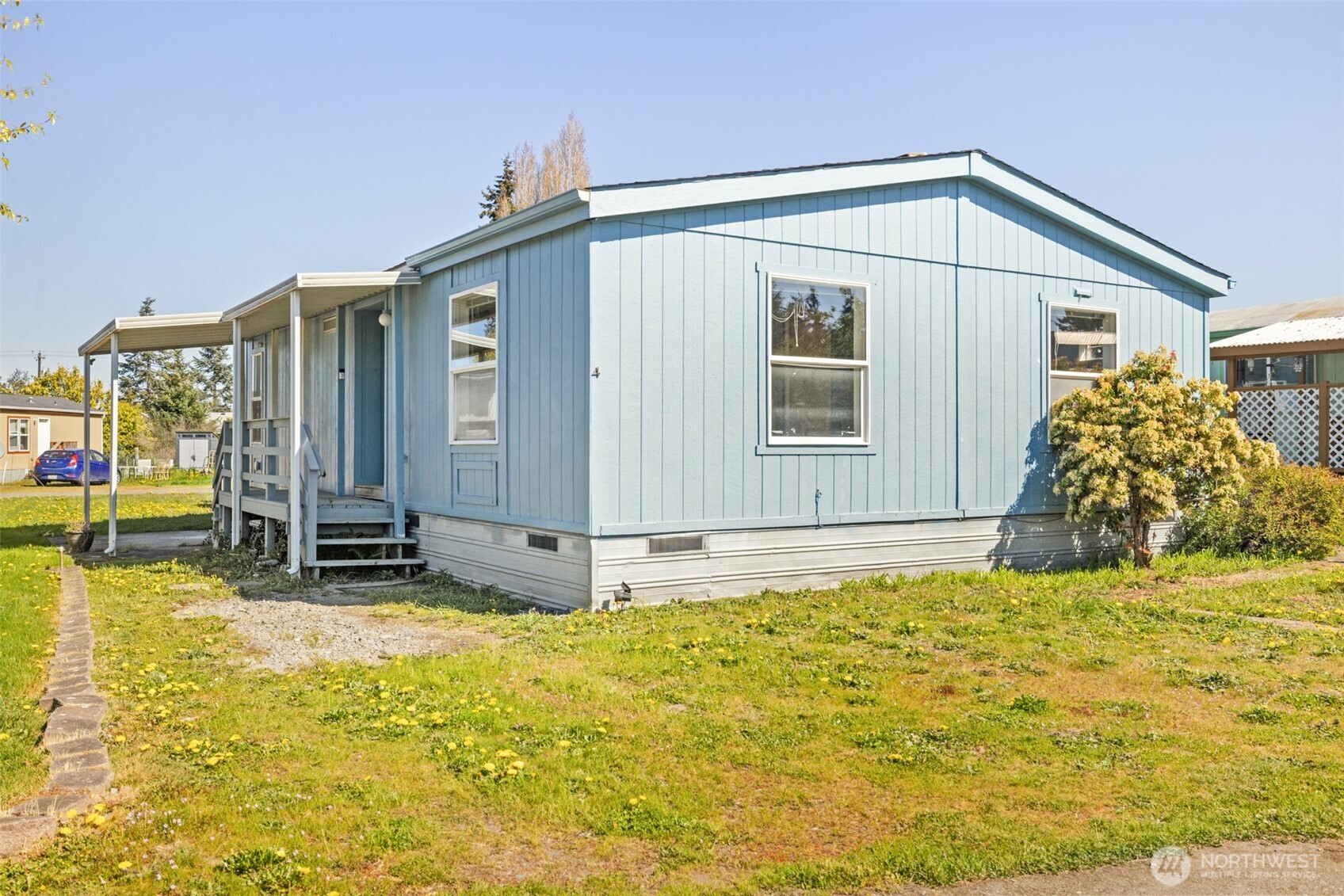 491 Mill Road, Unit 4 Sequim, WA 98382 - Photo 2 of 33 a bathroom with a sink and a large mirror