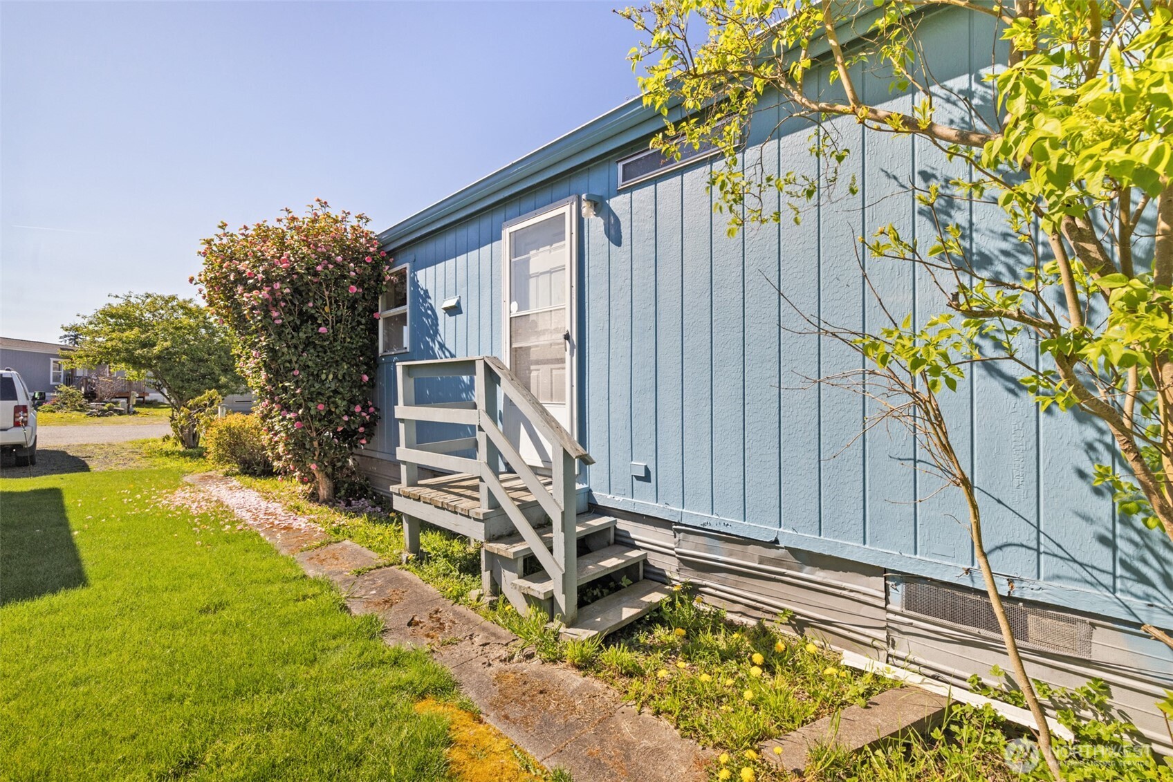 491 Mill Road, Unit 4 Sequim, WA 98382 - Photo 28 of 33 a view of a backyard with plants