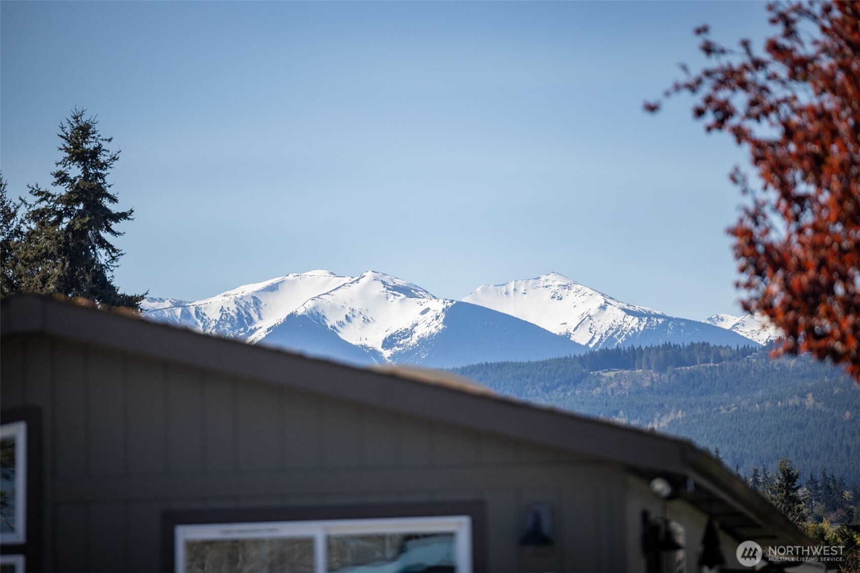 491 Mill Road, Unit 4 Sequim, WA 98382 - Photo 30 of 33 a view of a couches and a table in the balcony