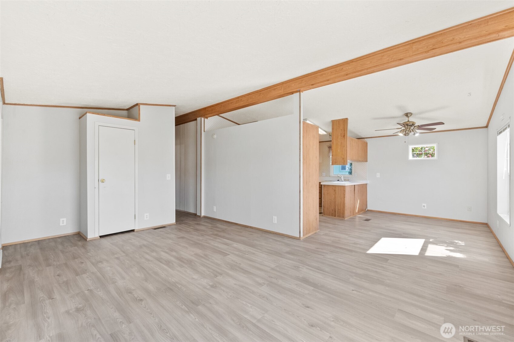 491 Mill Road, Unit 4 Sequim, WA 98382 - Photo 5 of 33 a view of empty room with wooden floor and cabinet