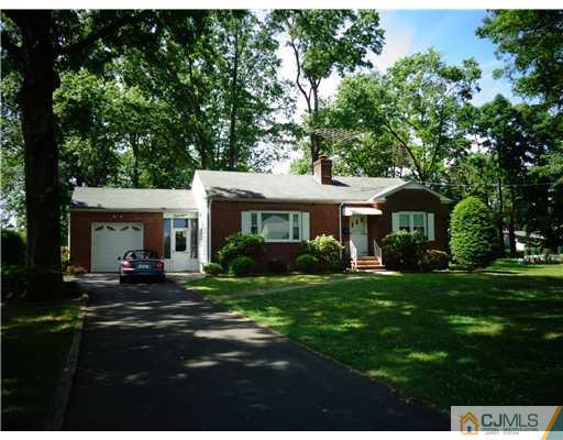 59 Orchard Road Middlesex, NJ 08846 - Photo 1 of 24 a front view of a house with a garden
